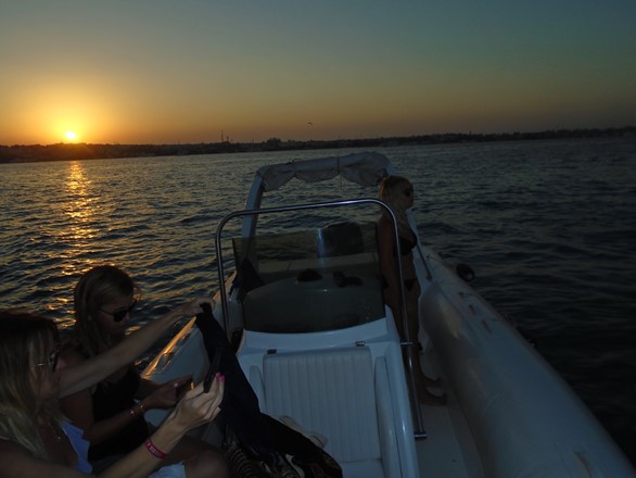 private speedboat by sunset time